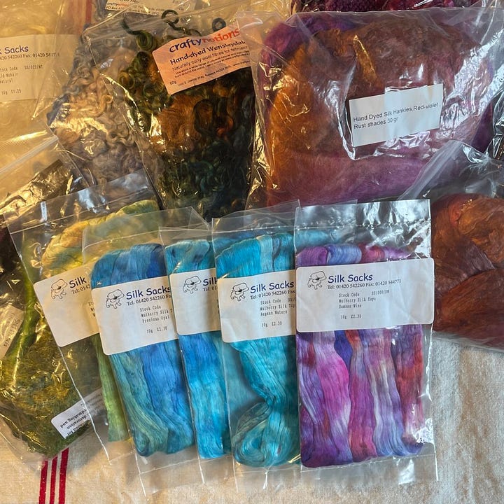 A lot of brightly coloured silk fiber for spinning