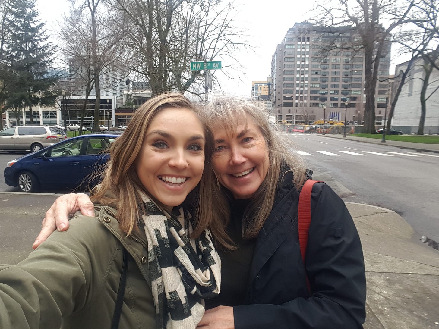 Cassidy and her mom, standing on a street corner in downtown Portland, from February 2016