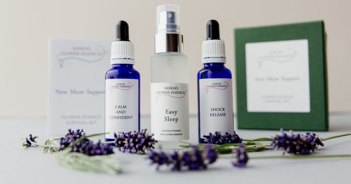The New Mum Support set includes three bottles of essence shown in this photo, with sprigs of lavender. The packaging for the set is shown in the background