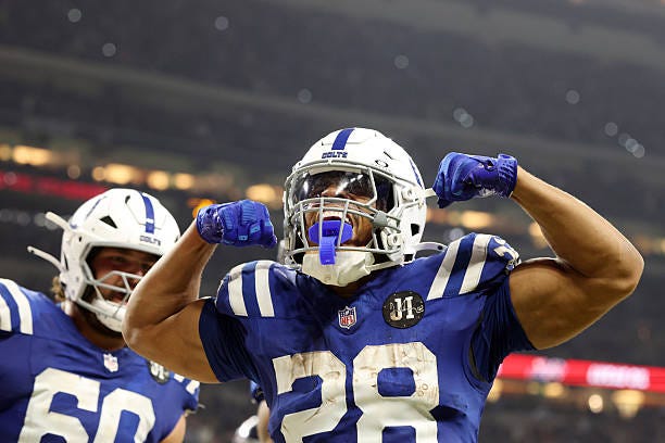 Jonathan Taylor of the Indianapolis Colts celebrates after scoring a rushing touchdown against the Tennessee Titans during the fourth quarter in the...