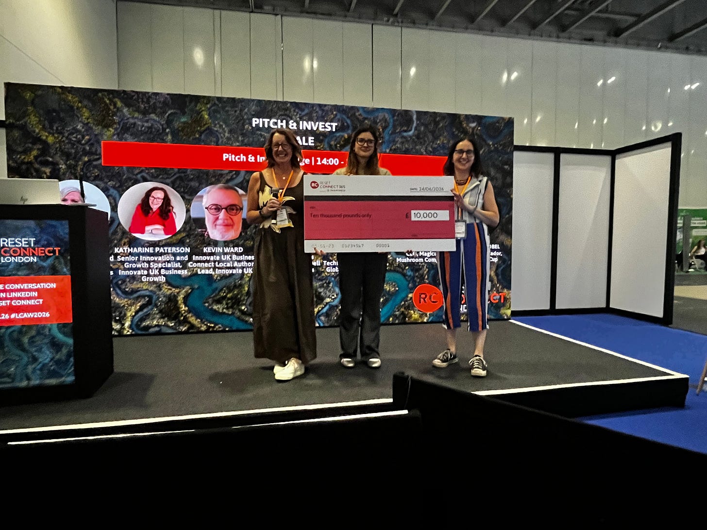 Photo of Louise receiving £10k prize