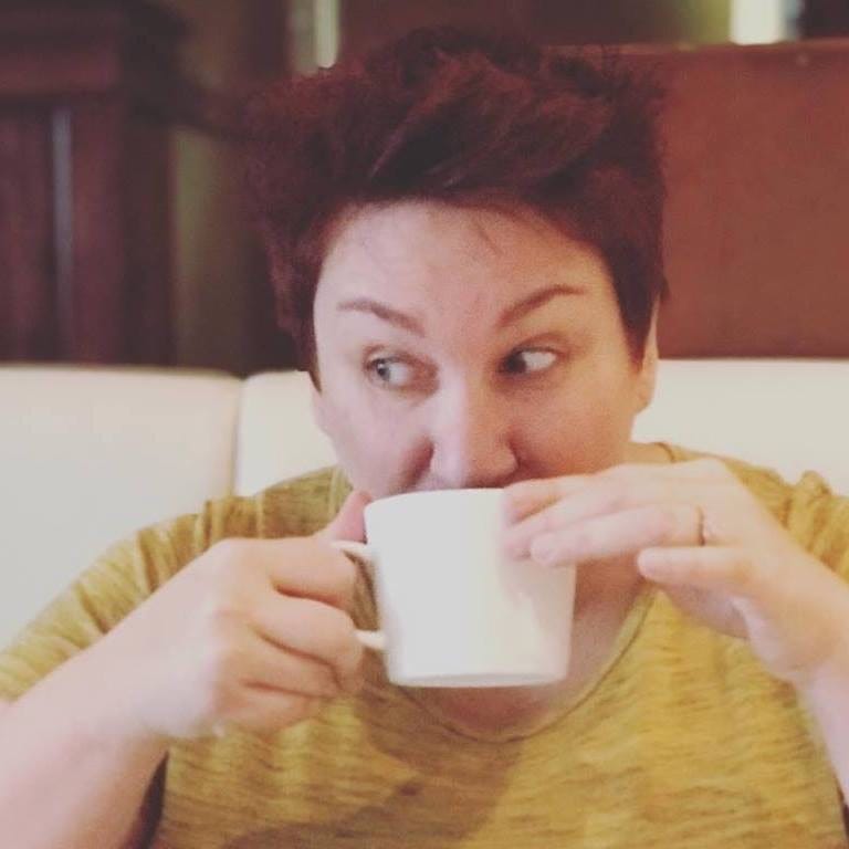 photo of Coach Jennie sipping coffee