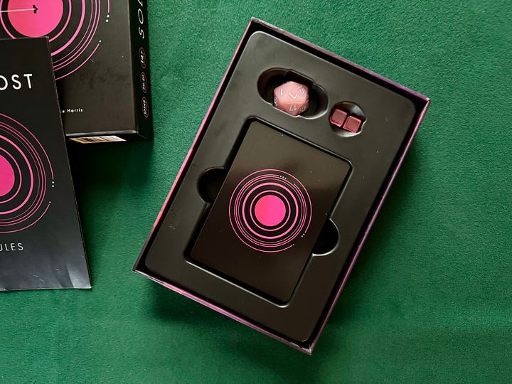 Solus: Lost, a card drawing, sci-fi, boss battler. The box is all black with pink design flourishes.