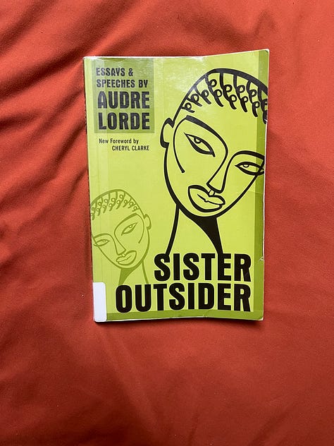 Table of colorful books, Sister Outside by Audre Lorde, Ymani and Ina smiling, Table with food, Ymani leaving a conference in an elevator, Cold brew coffee and plants.