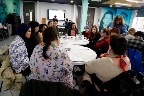 Images from the Disabled Women and Poverty event. Images include photos of group discussions and Alice reading a poem from the podium.