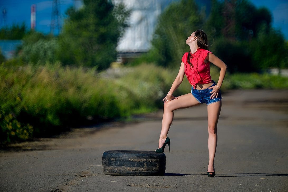 Woman wearing very skimpy shorts and high heels