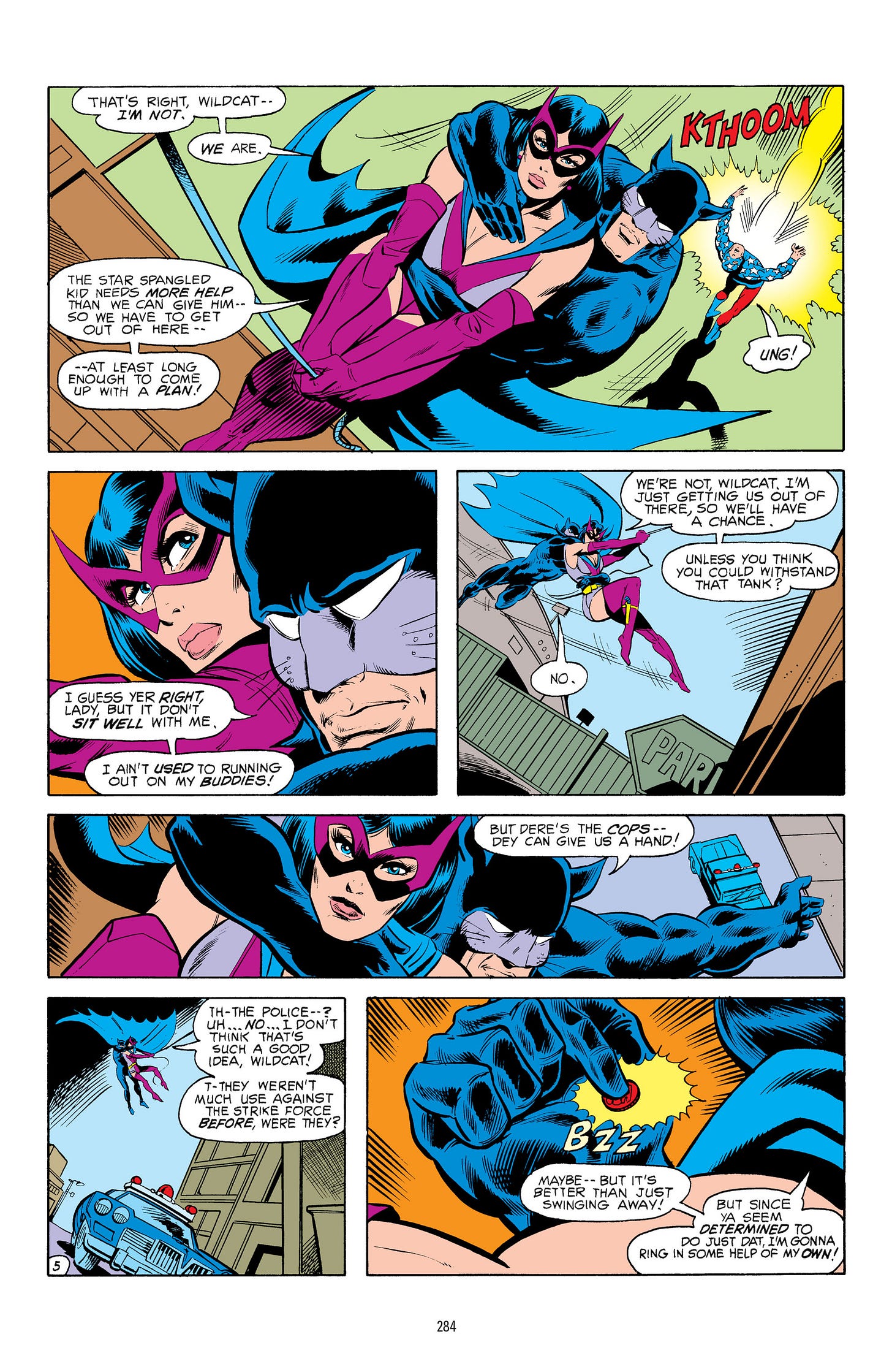 Helena Wayne as the Huntress rescues Wildcat from an altercation in All-Star Comics.