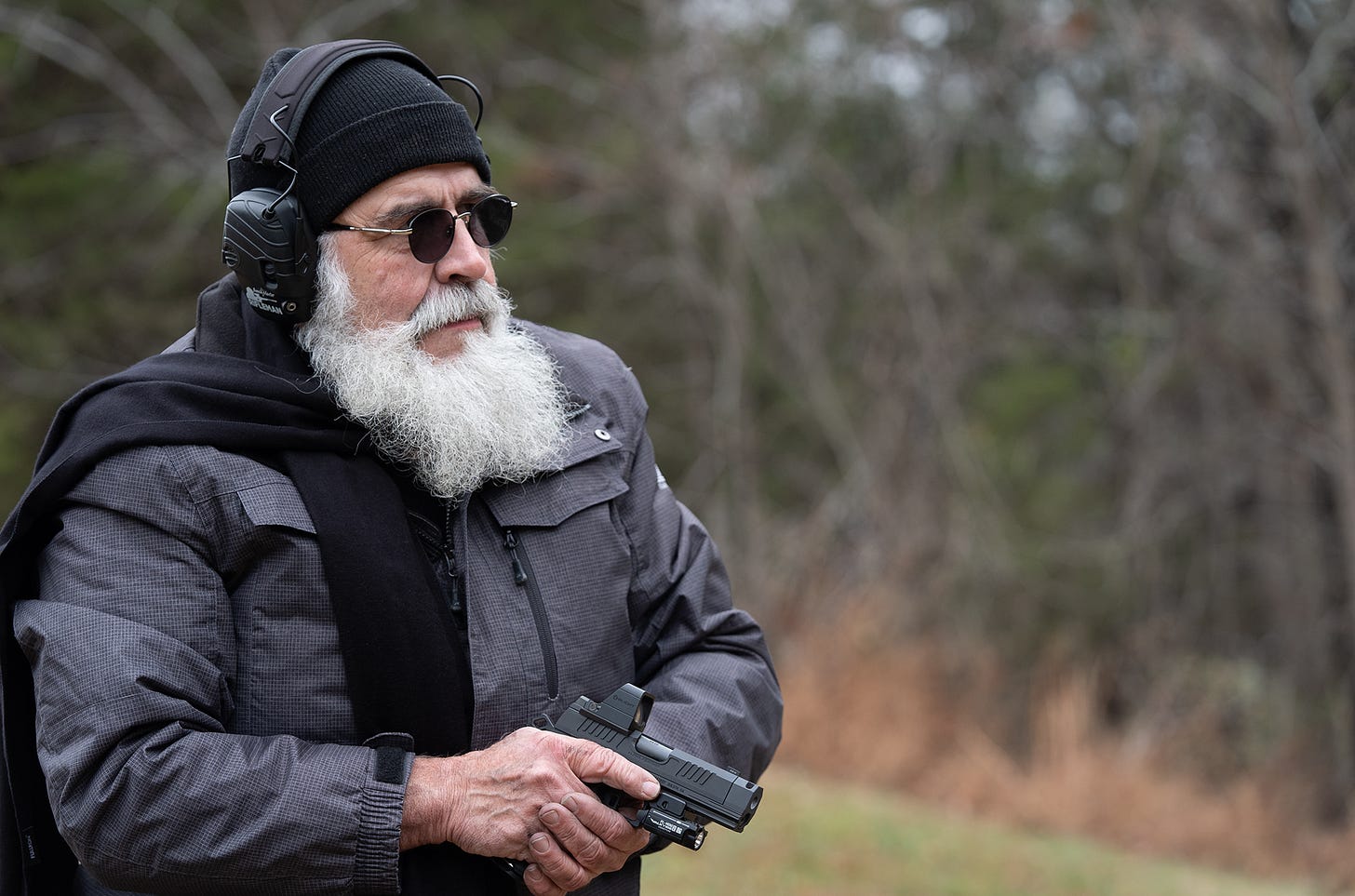 May be an image of one or more people and beard