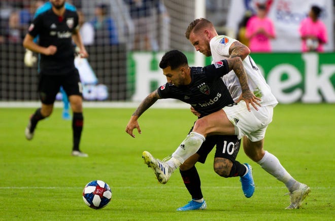 FC Cincinnati defender Maikel van der Werff (23) kicks the ball away from D.C. United midfielder Luciano Acosta (10) in the second half of the MLS match between FC Cincinnati and D.C. United on Sunday, Oct. 6, 2019, in Washington D.C. at Audi Field. FC Cincinnati defender Maikel van der Werff (23) kicks the ball away from D.C. United midfielder Luciano Acosta (10) in the second half of the MLS match between FC Cincinnati and D.C. United on Sunday, Oct. 6, 2019, in Washington D.C. at Audi Field.