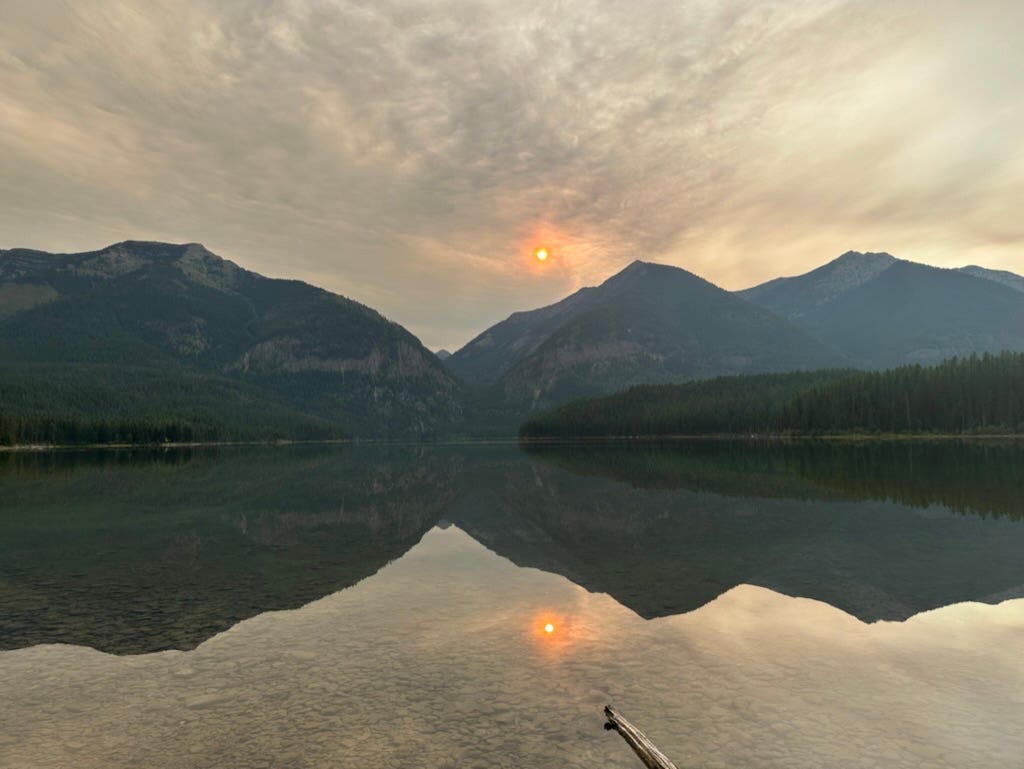 A body of water with mountains and clouds in the background
Description automatically generated A body of water with mountains and clouds in the background
Description automatically generated