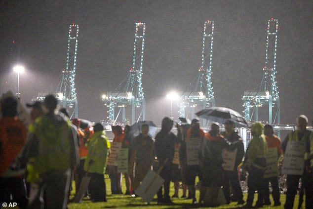 Hundreds of longshoremen strike together outside of the Virginia International Gateway in Portsmouth, Virginia, on Tuesday. Hundreds of longshoremen strike together outside of the Virginia International Gateway in Portsmouth, Virginia, on Tuesday.