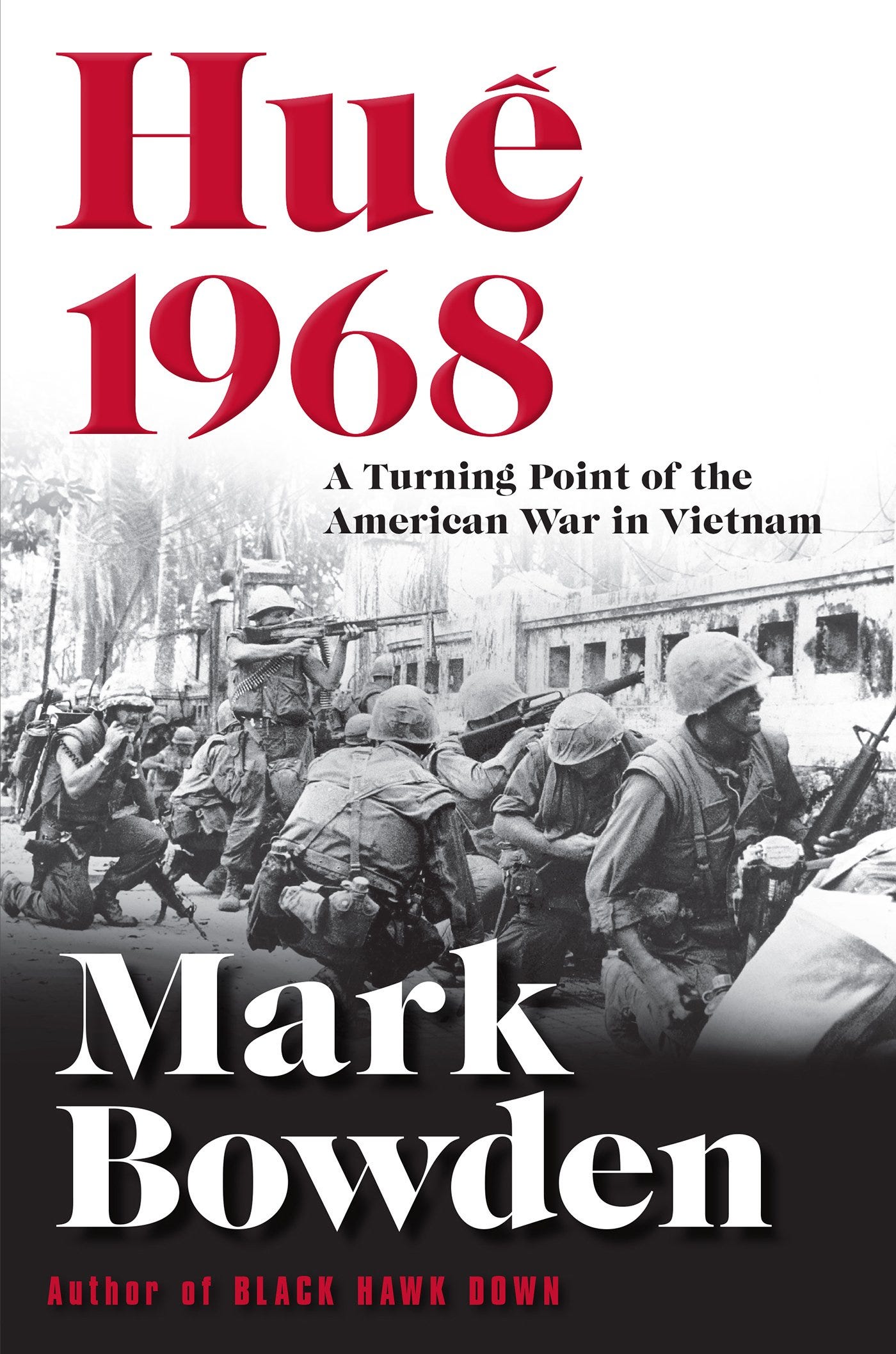 Cover of Huế 1968: A Turning Point of the American War in Vietnam by Mark Bowden. The design features a black-and-white wartime photograph of U.S. soldiers in combat, set against a destroyed urban backdrop. The title is in bold red and black text, with the author's name prominently displayed in white.