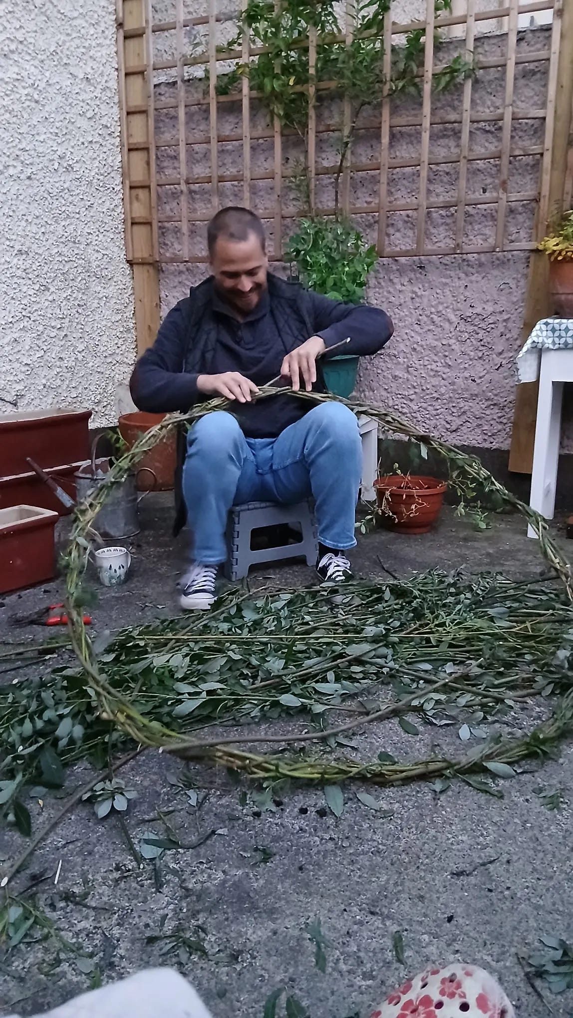 Russell weaving the willows into a belt or wreath Russell weaving the willows into a belt or wreath