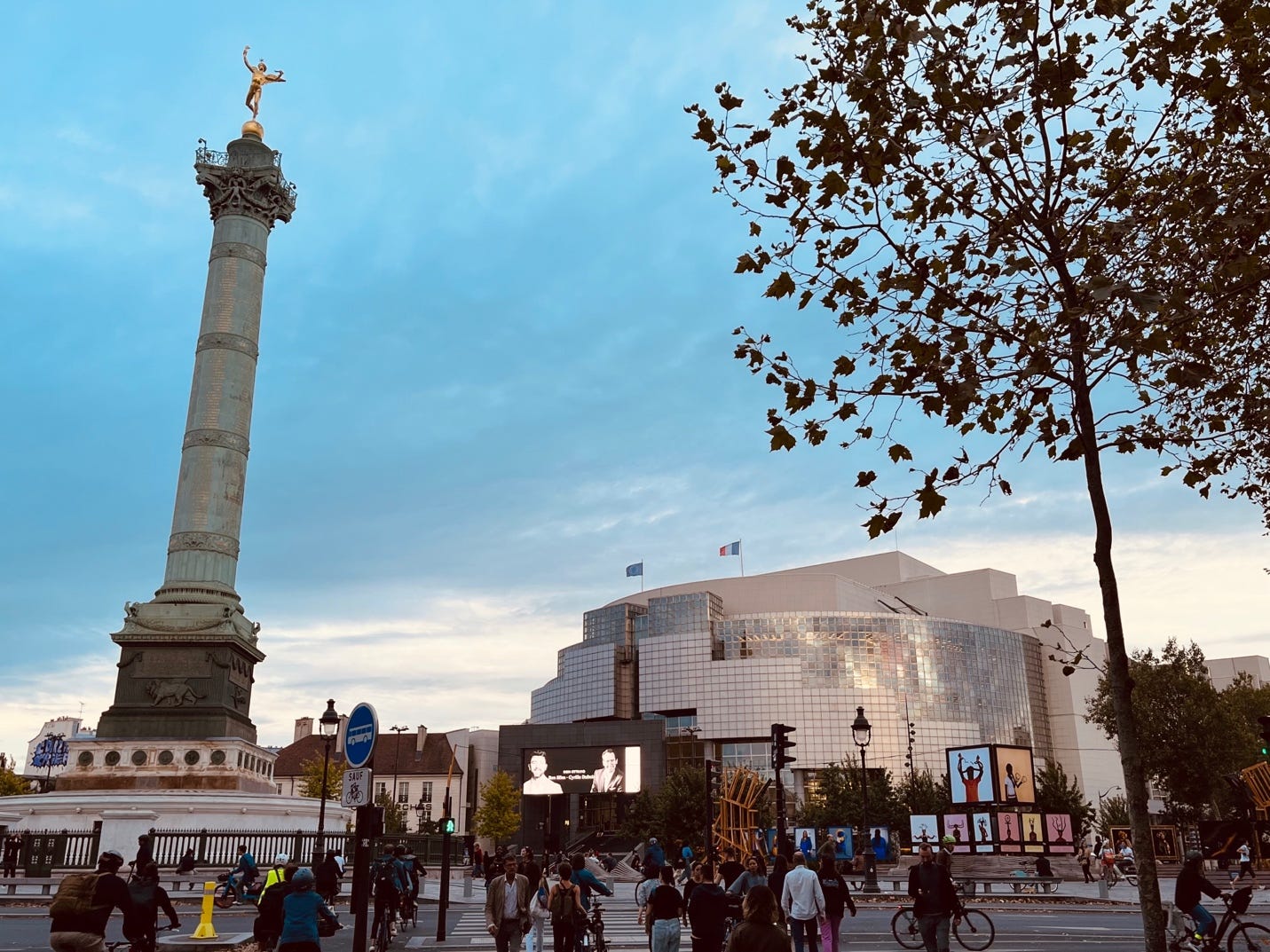 A tall monument with a statue on top

Description automatically generated