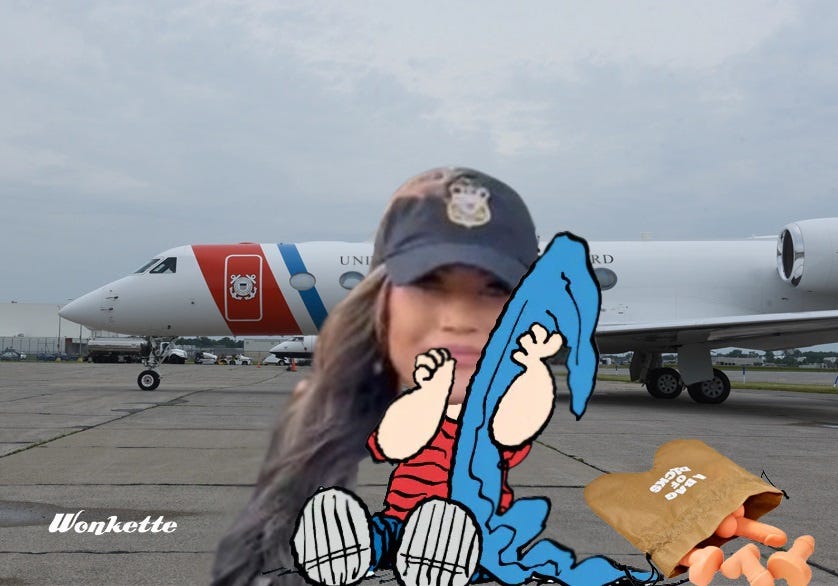 Photoshopped image based on a photograph of a Coast Guard executive jet on the tarmac. To that, we added an image in the foreground of Linus from Peanuts, sucking his thumb and holding his blue security blanket, but with Kirsti Noem's face, Border Patrol cap, and long flowing hair replacing Linus's face. In this latest revision, we have added a gag gift "bag of dicks," a cloth drawstring bag with two rounded pouches at the bottom, spilling several small silicone dldo replicas out of the open bag. Photoshopped image based on a photograph of a Coast Guard executive jet on the tarmac. To that, we added an image in the foreground of Linus from Peanuts, sucking his thumb and holding his blue security blanket, but with Kirsti Noem's face, Border Patrol cap, and long flowing hair replacing Linus's face. In this latest revision, we have added a gag gift "bag of dicks," a cloth drawstring bag with two rounded pouches at the bottom, spilling several small silicone dldo replicas out of the open bag.