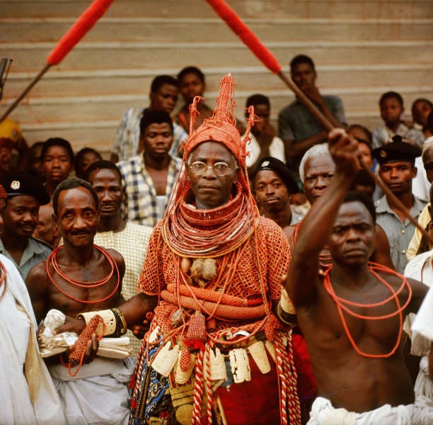 The late Oba Akenzua II in full regalia, including a coral garment and headpiece, Coral is an important symbol of the identity of the Oba, ruler of...
