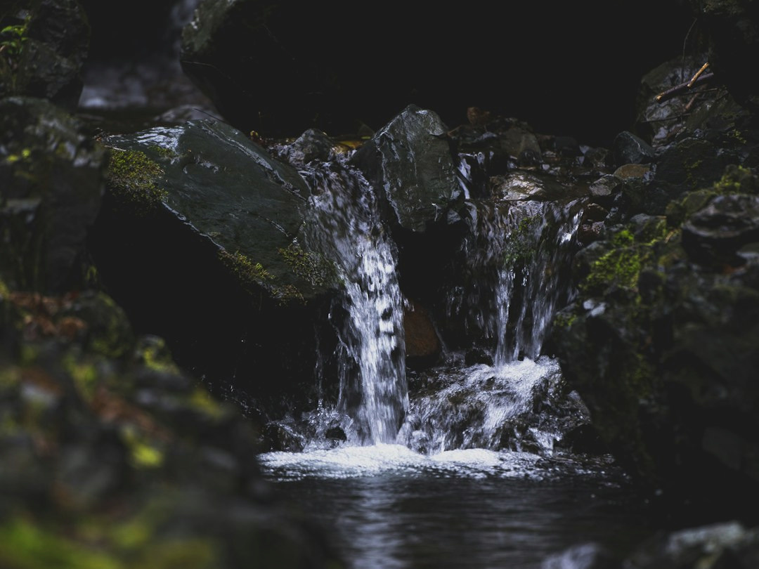 a small waterfall in a rocky place