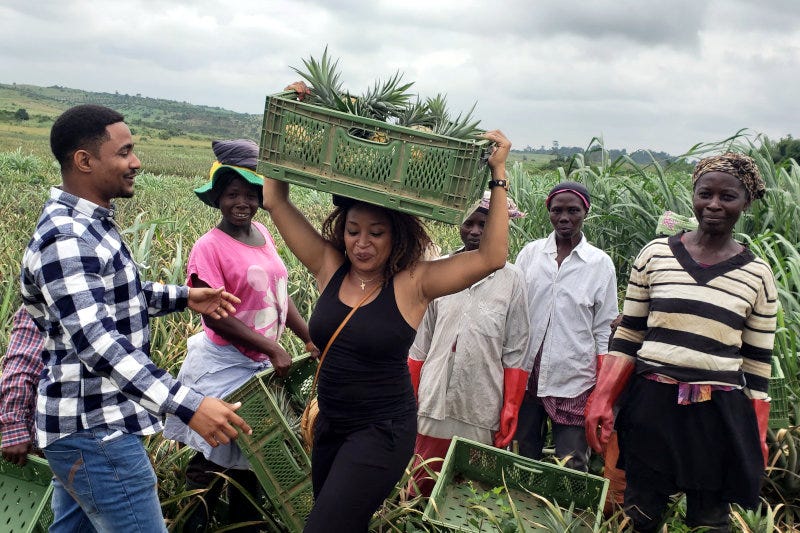 Ada Osakwe with pineapple farmers in Nigeria. Ada Osakwe with pineapple farmers in Nigeria.