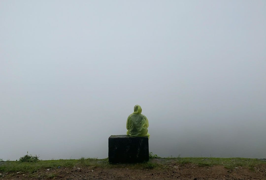 a person sitting on a bench