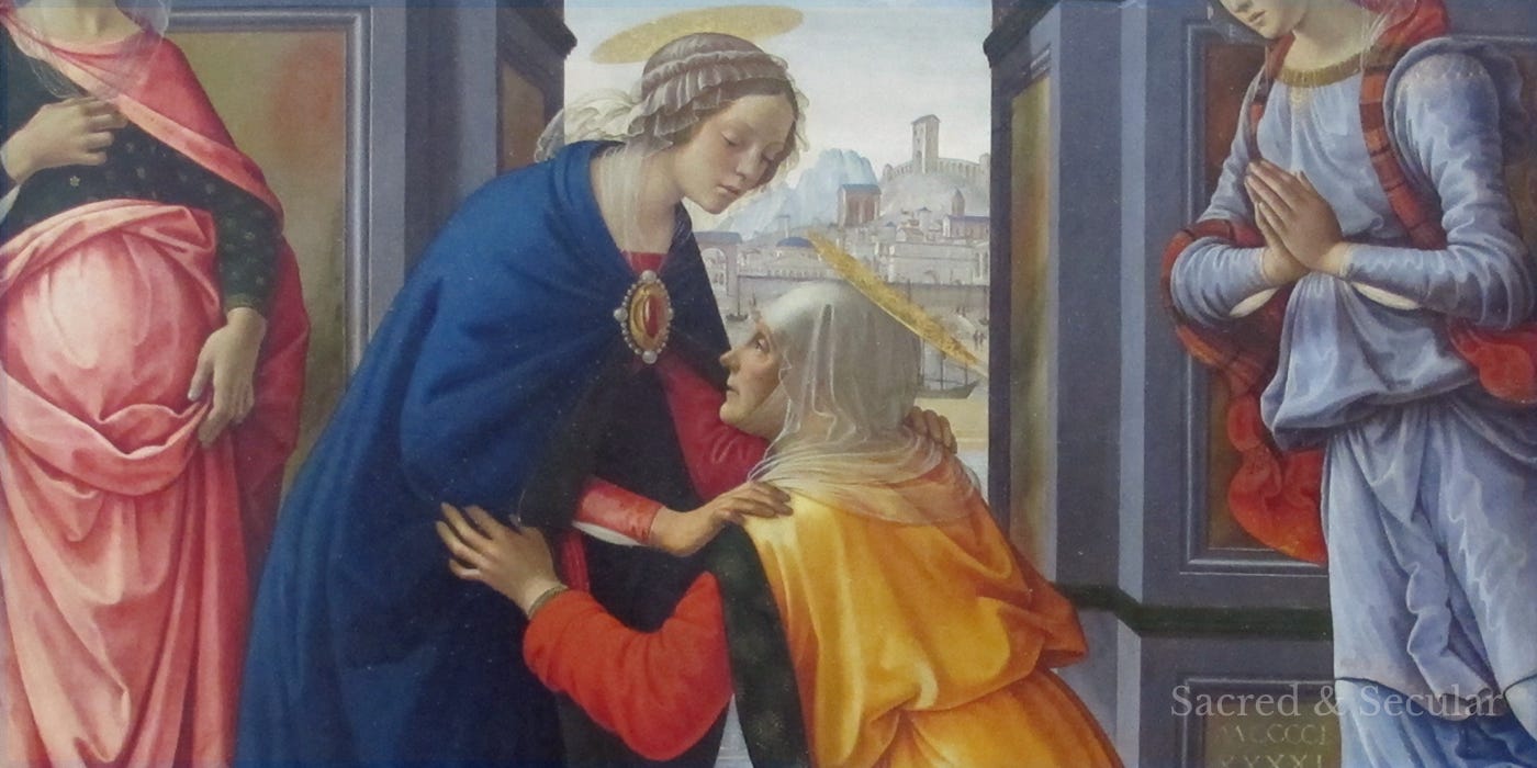 A Renaissance painting showing Elizabeth kneeling before Mary beneath a large stone arch. Mary wears red and blue, two other women stand nearby, and a distant city and landscape appear behind them. A Renaissance painting showing Elizabeth kneeling before Mary beneath a large stone arch. Mary wears red and blue, two other women stand nearby, and a distant city and landscape appear behind them.