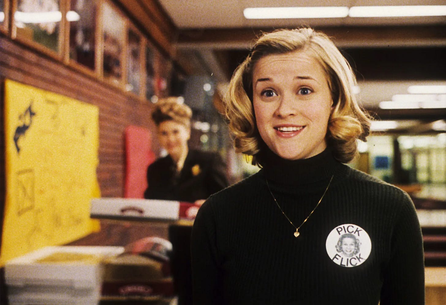 A still from the 1999 film "Election." Overachieving high schooler Tracy Flick (Reese Witherspoon) eagerly promotes her campaign for class president, wearing a "Pick Flick" pin. A still from the 1999 film "Election." Overachieving high schooler Tracy Flick (Reese Witherspoon) eagerly promotes her campaign for class president, wearing a "Pick Flick" pin.
