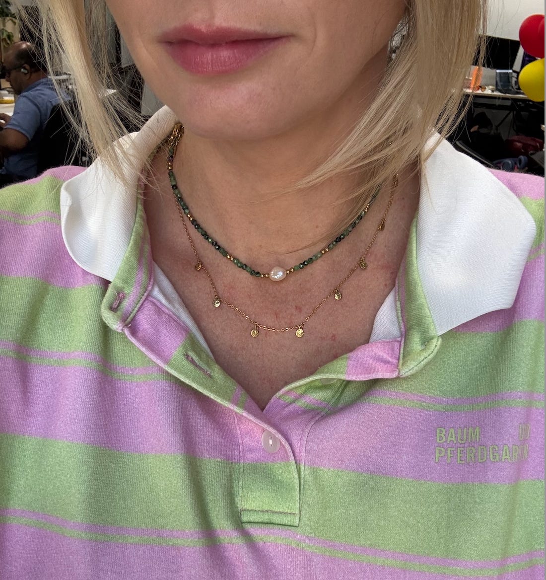 Selfie of Jessie wearing green beaded necklace.