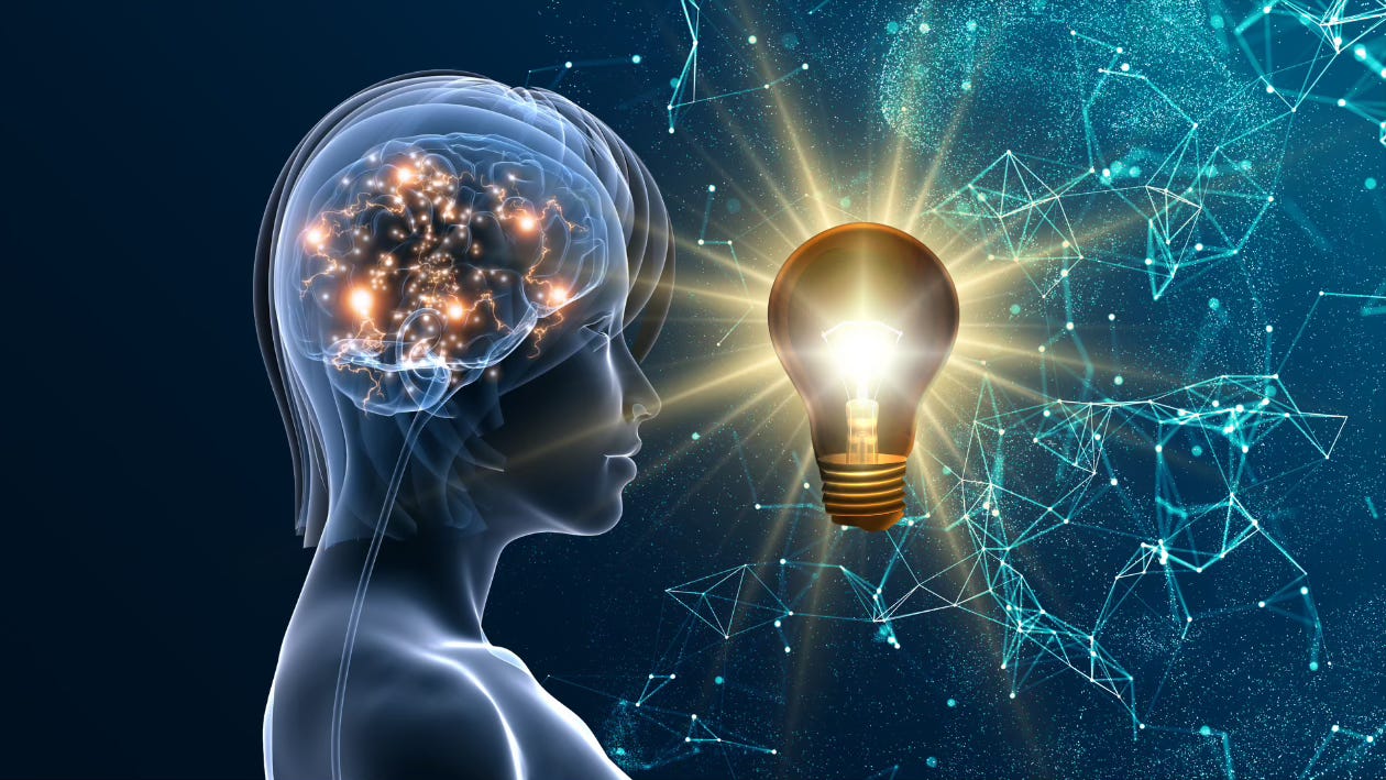 A person stands in the uninterrupted darkness of a midnight sky. A lightbulb bursts to golden life, sparking a myriad constellations of connection. Inside her brain, mirrored sparks and pathways of "ah-hah" ignite.