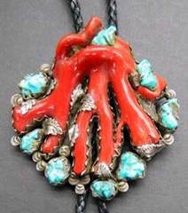 A close-up of a red coral and turquoise necklace

AI-generated content may be incorrect.