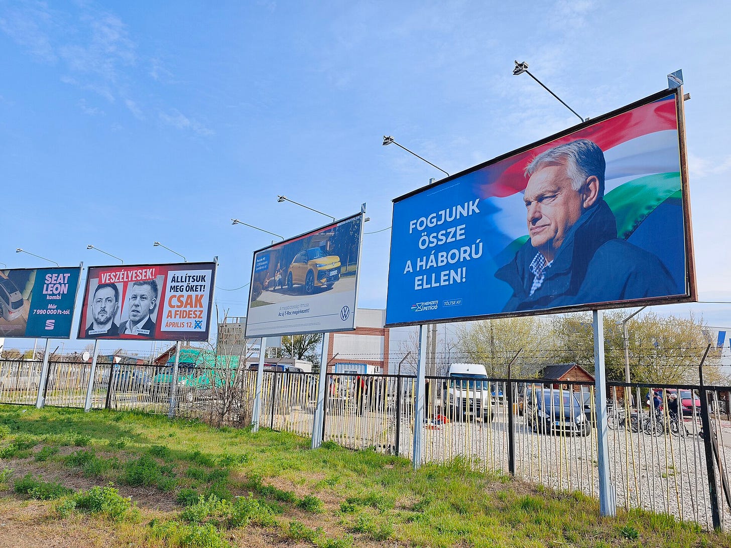 Campaign posters for Hungary’s 2026 parliamentary election displayed outdoors in Budapest, photographed in March 2026. The image shows election advertising in a public space associated with the campaign environment around the vote. Campaign posters for Hungary’s 2026 parliamentary election displayed outdoors in Budapest, photographed in March 2026. The image shows election advertising in a public space associated with the campaign environment around the vote.