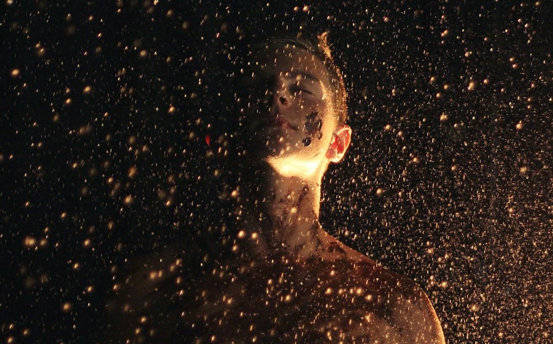 photo of man closing his eyes