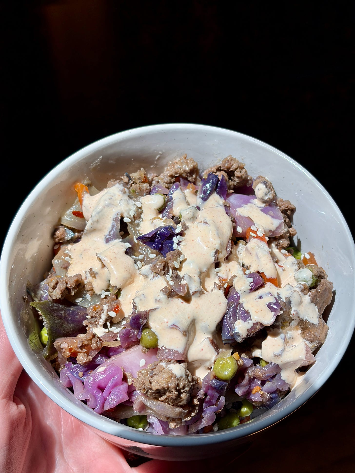 Easy Ancestral beef & cabbage stir fry with spicy mayo and sesame seeds on top