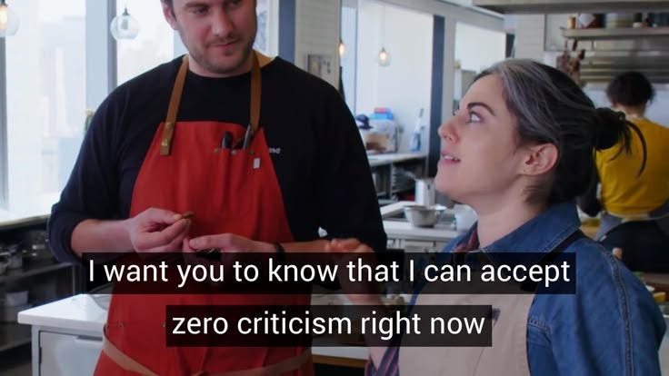 This may contain: a man standing next to a woman in an industrial kitchen with the words, i want you to know that i can accept zero cricim right now