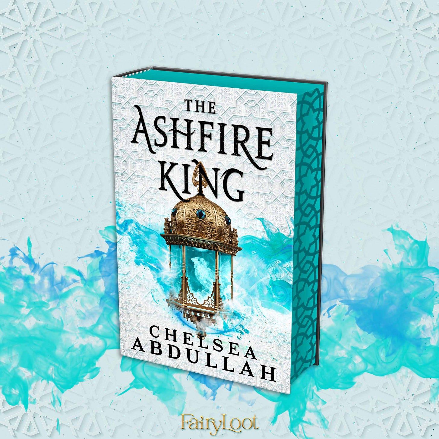 A graphic featuring FairyLoot's edition of THE ASHFIRE KING. The book has a white background with a lantern that hangs off the letters of the title. Inside the lantern is a bird made of fire. (The fire on this edition is aqua blue). This edition also has blue stenciled edges that feature diamond-like shapes.