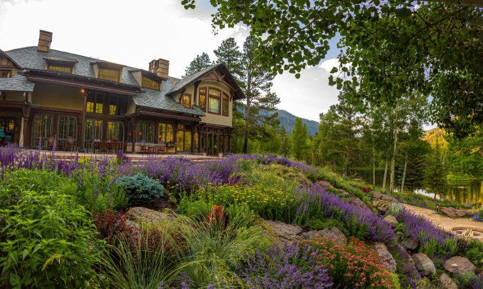 A large house with landscaped grounds.