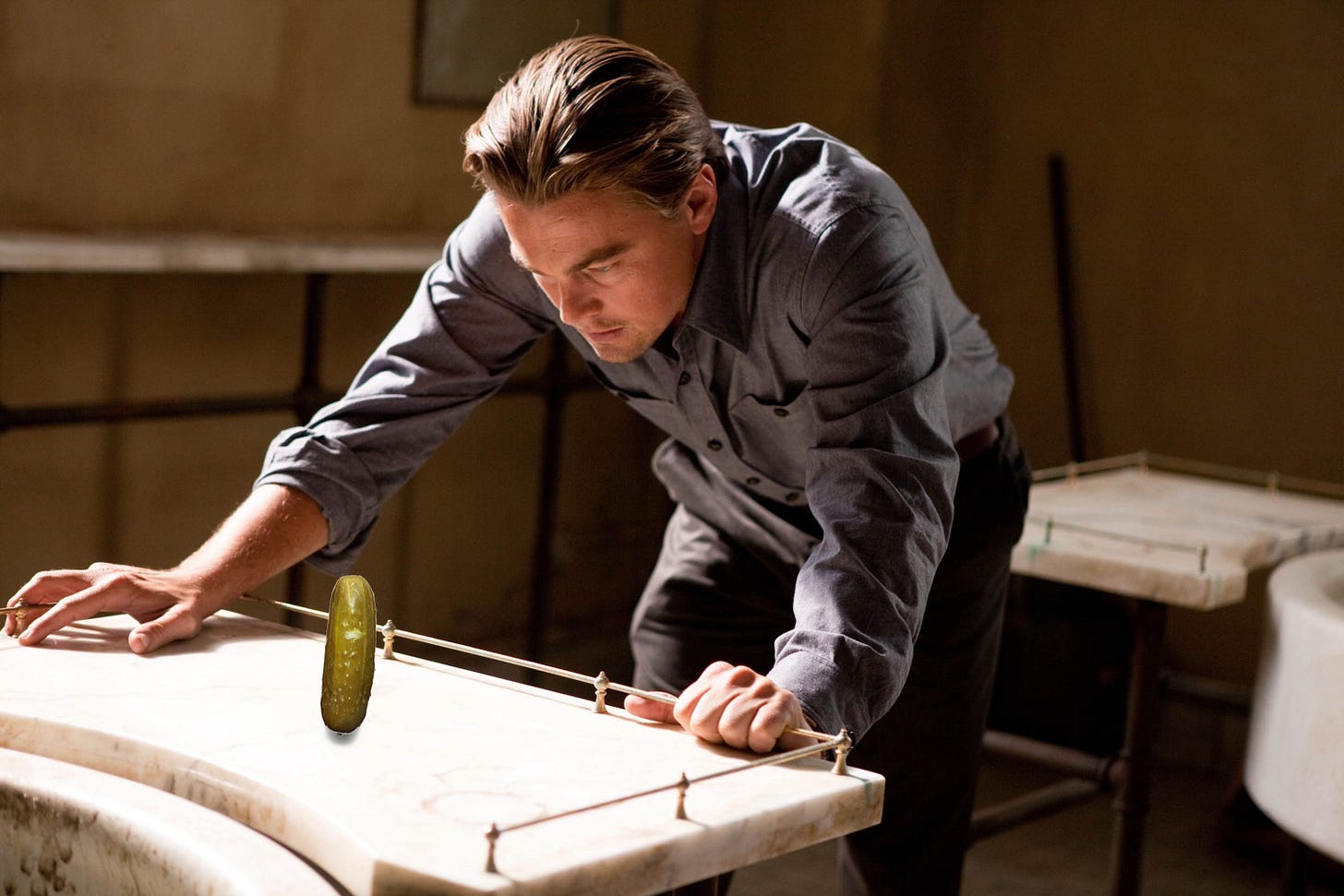 Leonardo DiCaprio in Inception looking down at a pickle instead of a top Leonardo DiCaprio in Inception looking down at a pickle instead of a top