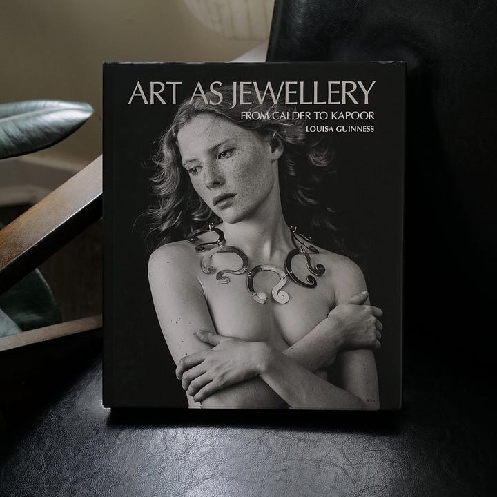 Two photos with cover and interior of the book on jewelry.