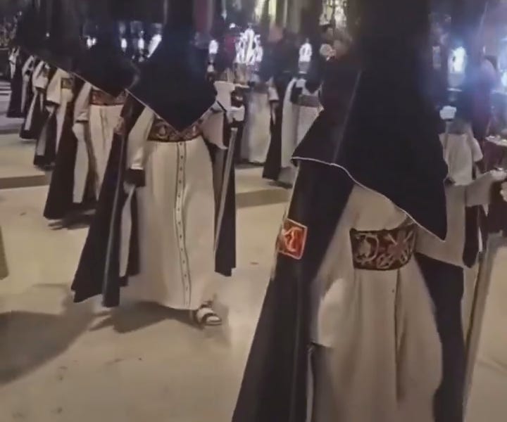 WHY ARE THEY WEARING KKK HOODS AT THE POPES FUNERAL