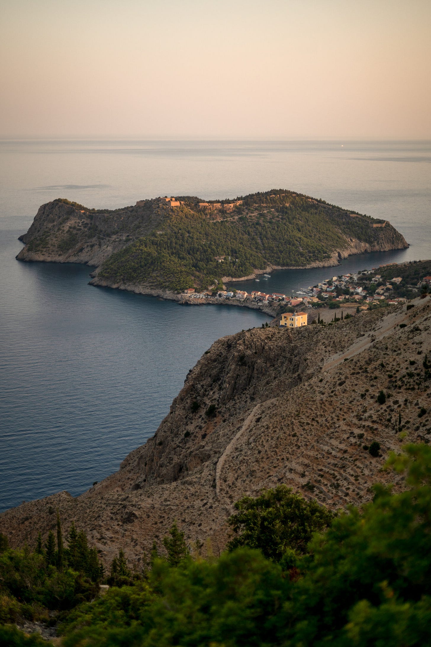 An aerial view of a peninsula connected by an isthmus.