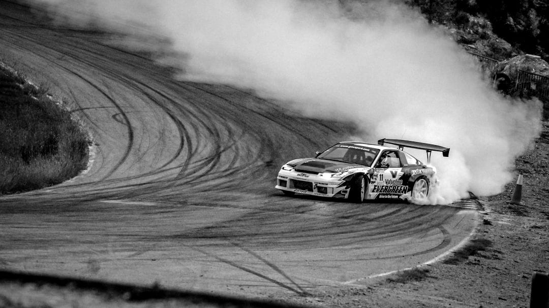 white and blue car drifting on wall