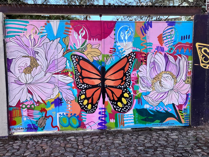 Images of murals with birds, butterflies, hearts, and hands