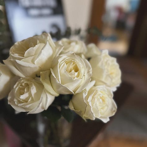 white roses, Haruki Murakami book and journal, rainbow cookies, lake michigan, American fiction movie poster, close up of collage
