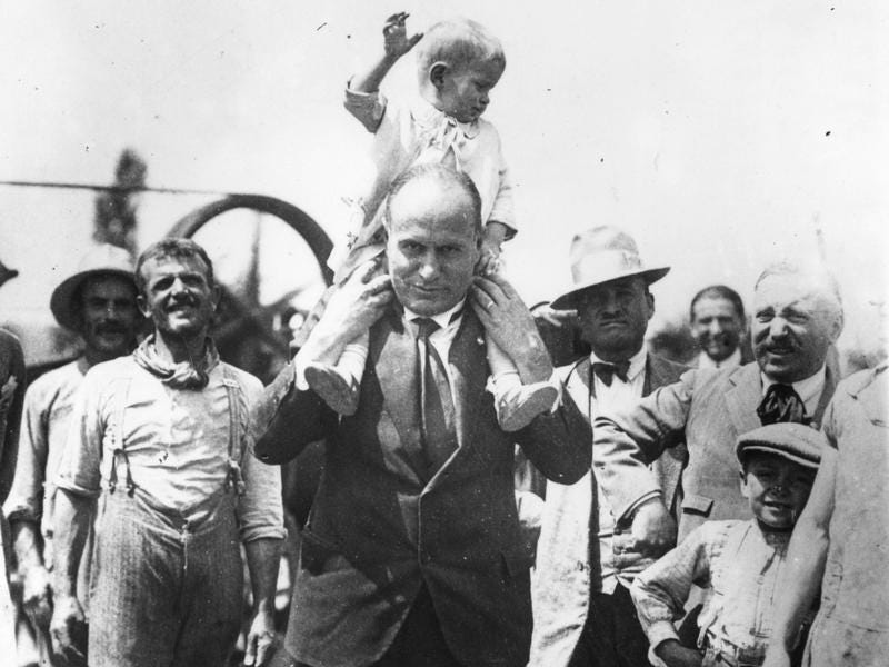 A rare personal moment: Benito Mussolini carrying his son on his shoulders in 1935. A rare personal moment: Benito Mussolini carrying his son on his shoulders in 1935.