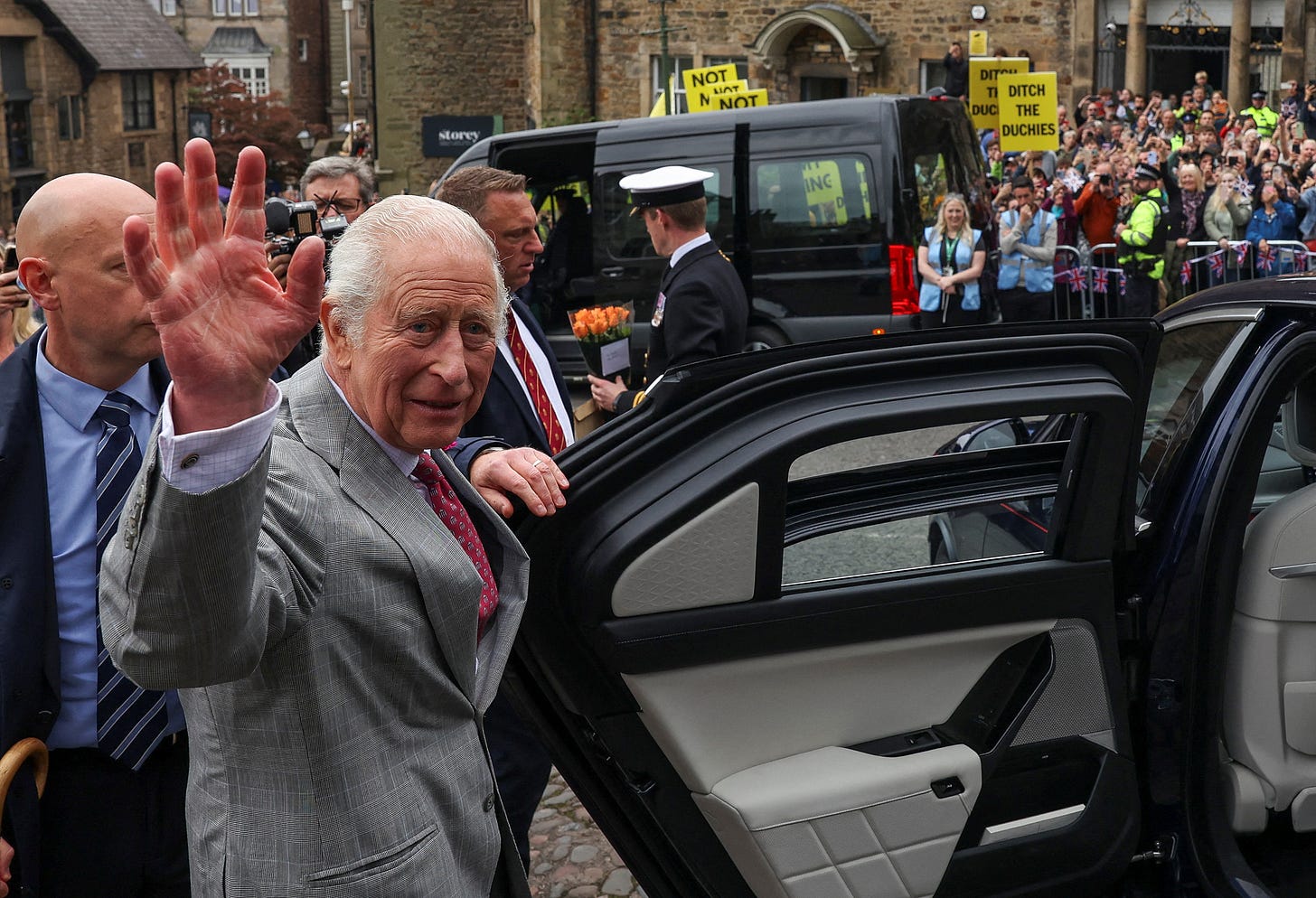 King Charles getting into a car