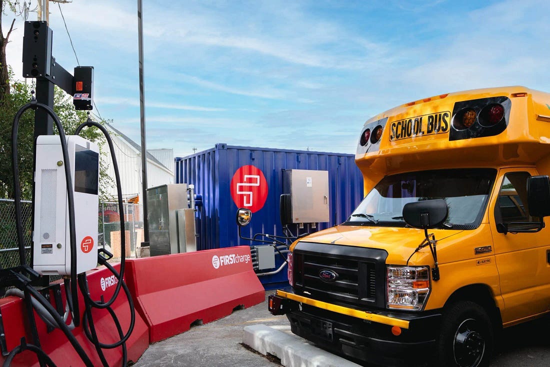 school bus connected to First Charge above ground charging station