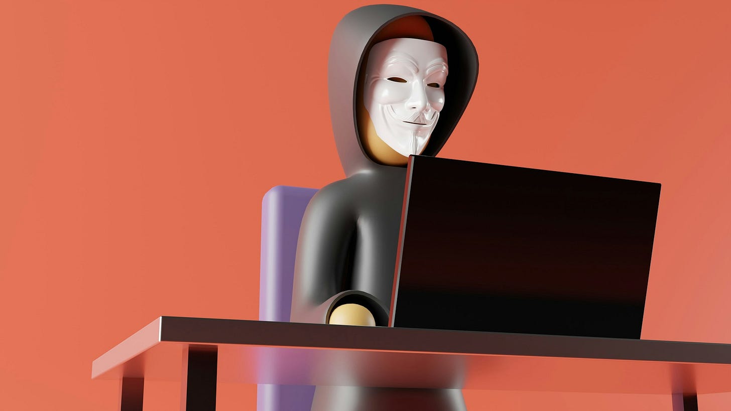 Illustration of a hacker in a hooded sweatshirt wearing a white mask while using a laptop, symbolizing online scams and cybersecurity risks. Photo by Guerrilla Buzz on Unsplash