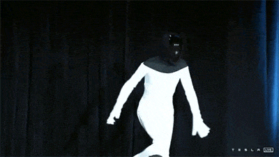 Tesla Previews Robot with Human in Spandex Suit