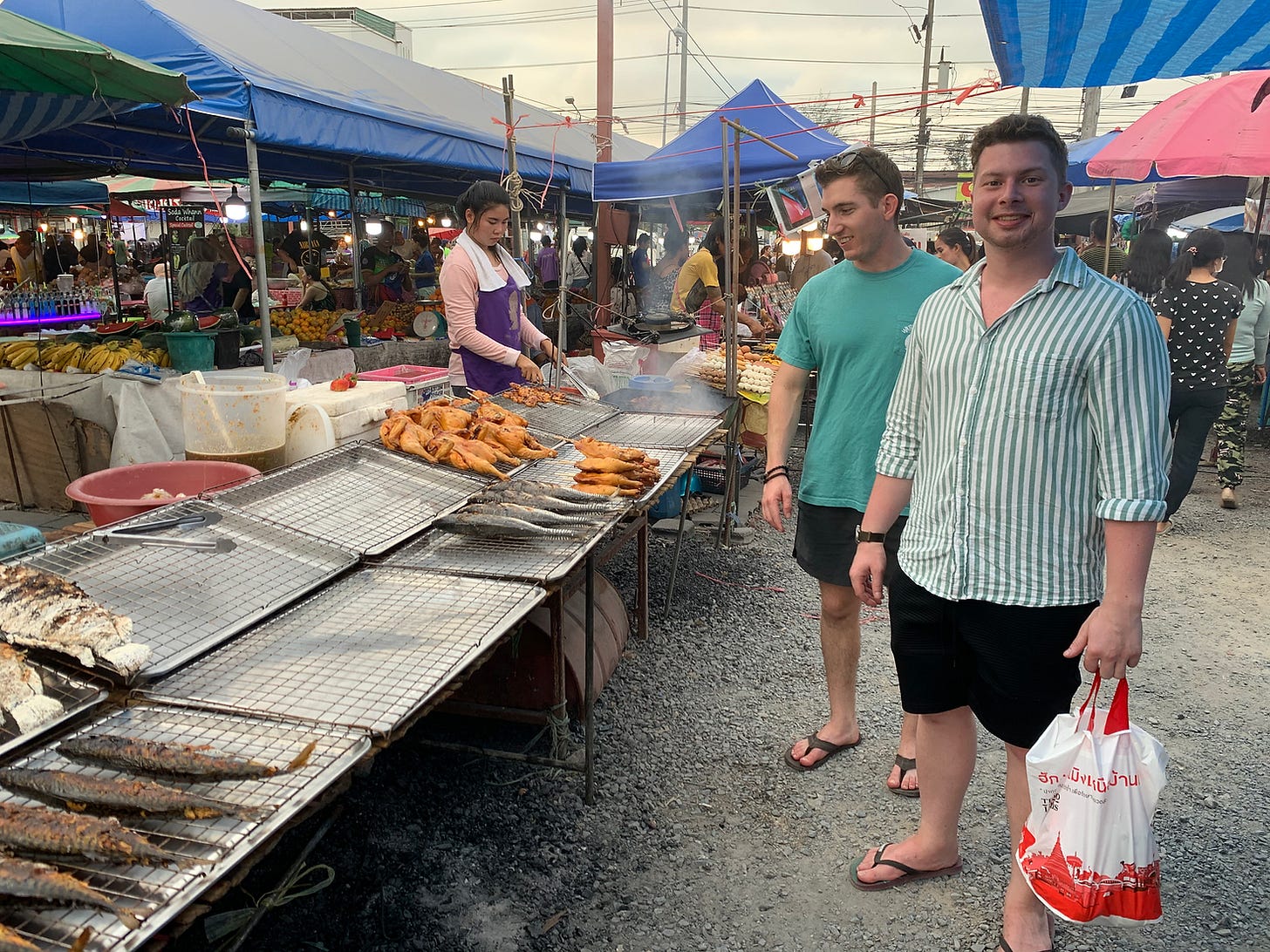 SLEKE. co-founders Austin & Brennan at an outdoor market in Thailand