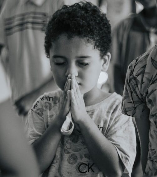 man in white crew neck t-shirt smoking cigarette