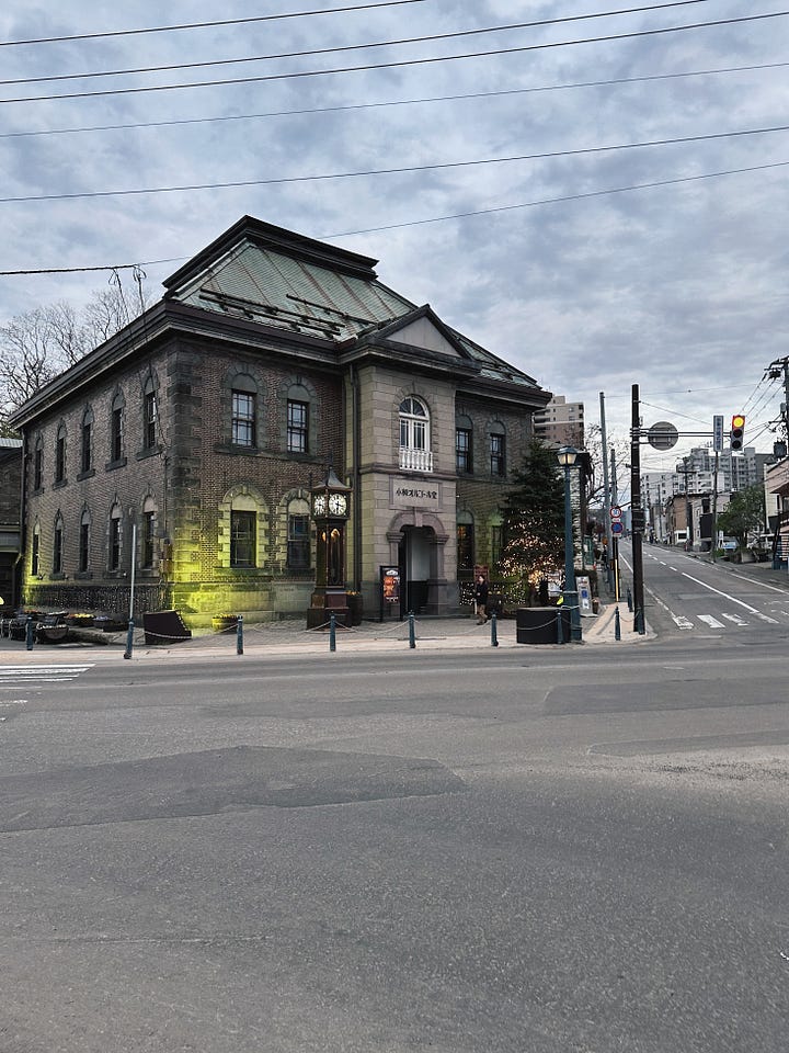 Scenes from Otaru, including a bowl of Hokkaido crab, the historic canal, handblown glassware, and the Otaru Music Box Museum