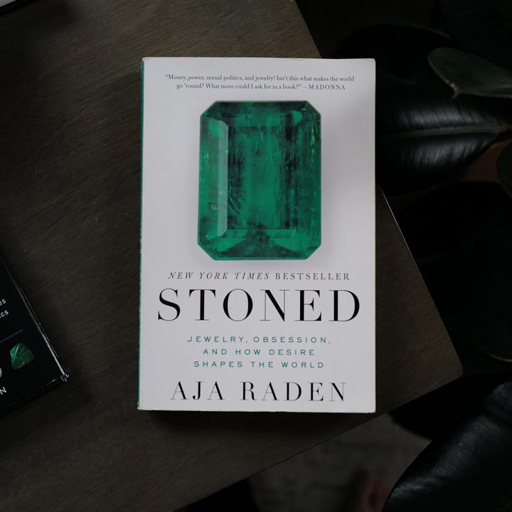 Two photos with cover and interior of the book on jewelry.